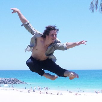 Ivan demonstrating a ballet move at the beach
